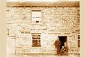 ABk81-Bendgate Farm, Back door with Thomas and Catherine Wrathall and grandson Law